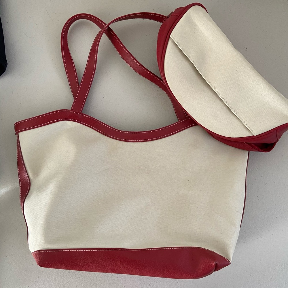 Estée Lauder cream and red bag plus makeup bag